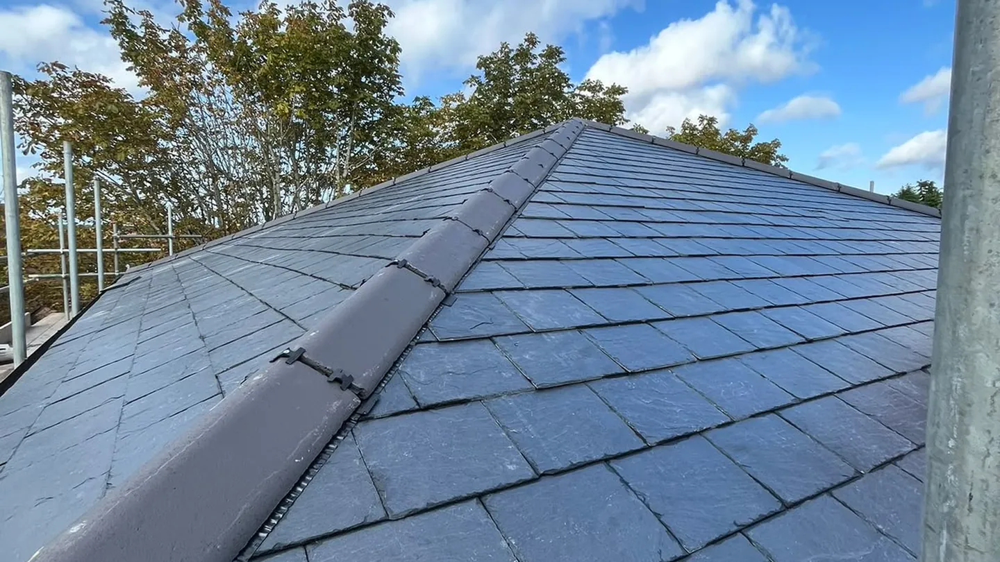 Slate roof with a new lead-lined ridge