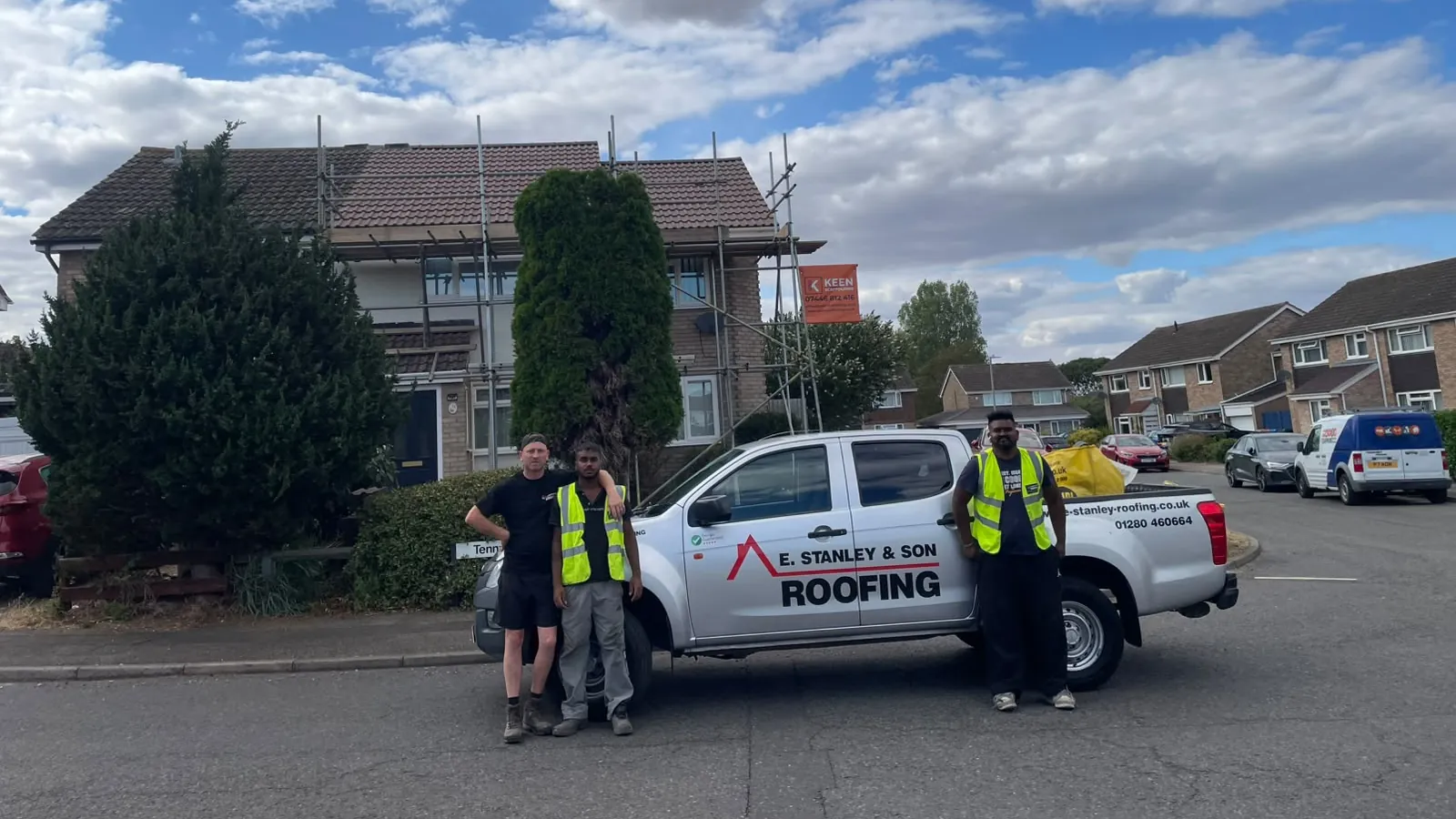 The E Stanley & Son Roofing crew with the company van