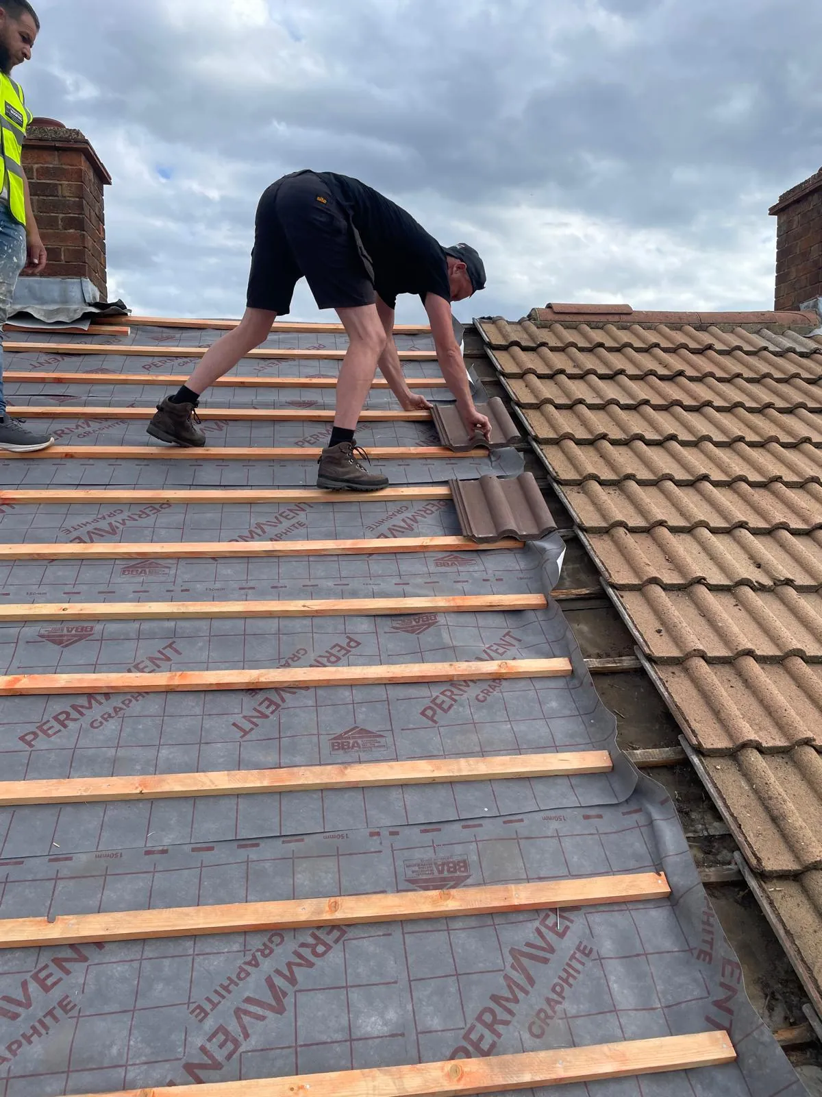 Laying interlocking tiles on new battens